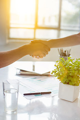 Image showing Business partnership meeting concept. Image businessmans handshake. Successful businessmen handshaking after good deal. Horizontal, blurred background