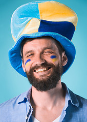 Image showing The football fan over blue