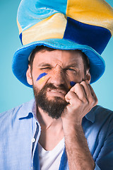 Image showing The football fan over blue