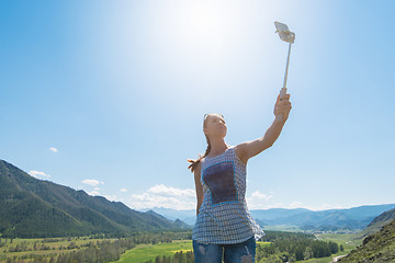 Image showing Woman taking selfie on mobile phone