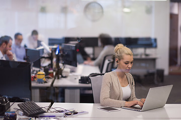 Image showing businesswoman using a laptop in startup office