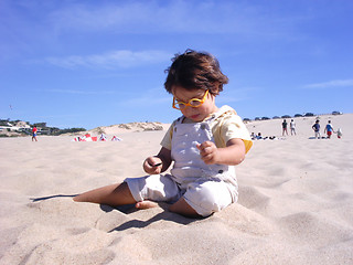 Image showing kid playing with sand
