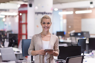 Image showing Business Woman Using Digital Tablet in front of startup Office