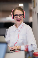 Image showing businesswoman using a laptop in startup office