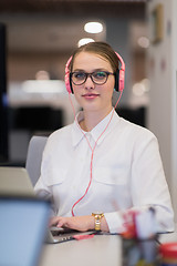 Image showing businesswoman using a laptop in startup office