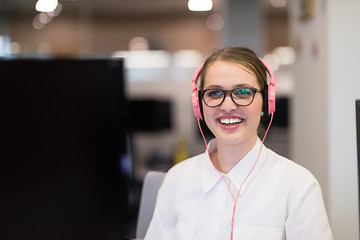 Image showing businesswoman using a laptop in startup office