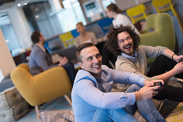 Image showing startup Office Workers Playing computer games