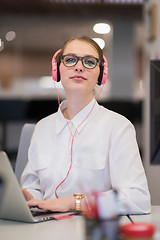 Image showing businesswoman using a laptop in startup office