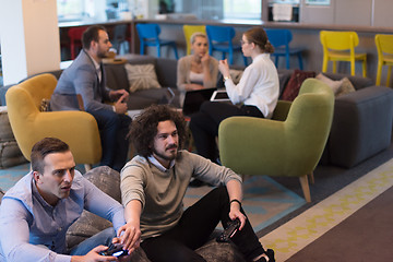 Image showing startup Office Workers Playing computer games