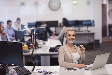 Image showing businesswoman using a laptop in startup office