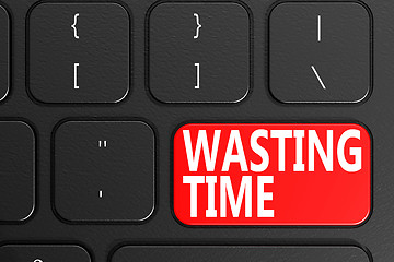 Image showing Wasting Time on black keyboard