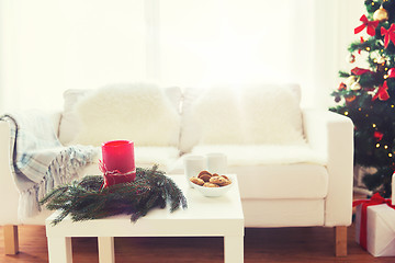 Image showing sofa, table and christmas tree with gifts at home