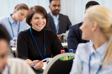 Image showing business people at conference with papers