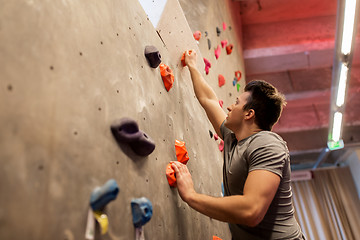 Image showing young man exercising at indoor climbing gym