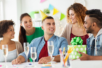 Image showing team greeting colleague at office birthday party