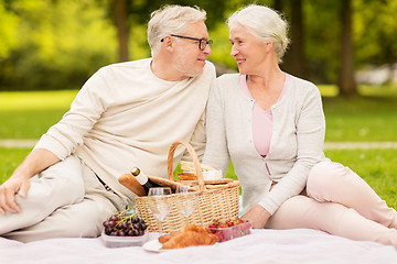 Image showing happy senior couple having picnic at summer park