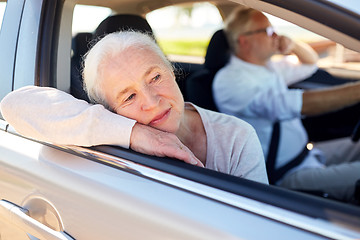 Image showing happy senior couple driving in car