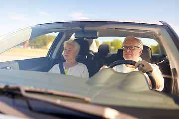 Image showing happy senior couple driving in car