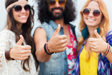 Image showing happy young hippie friends showing thumbs up