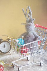 Image showing Elk and others christmas toys in shopping trolley