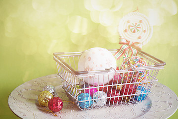 Image showing Christmas toys in shopping basket, retro toned