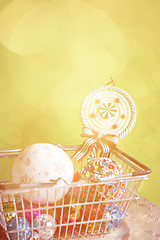 Image showing Christmas balls in shopping basket, retro toned