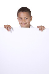 Image showing Cute little boy holding a blank sign
