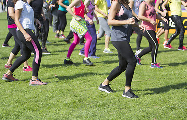 Image showing Group of young girls exercising fitness with dancing in the city