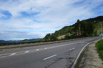 Image showing Road into hills with blue sky at Sabah