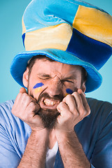 Image showing The football fan over blue