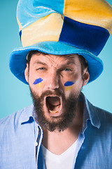 Image showing The football fan over blue