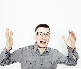 Image showing young handsome teenage hipster guy posing emotional, happy smiling against white background isolated, lifestyle people concept 