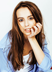 Image showing young pretty teenage hipster girl posing emotional happy smiling on white background, lifestyle people concept 