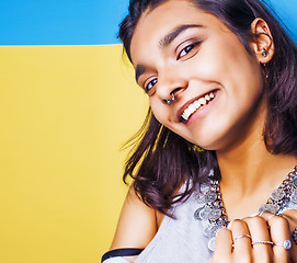 Image showing lifestyle people concept. young pretty smiling indian girl with long nails wearing lot of jewelry rings, asian summer happy cool close up