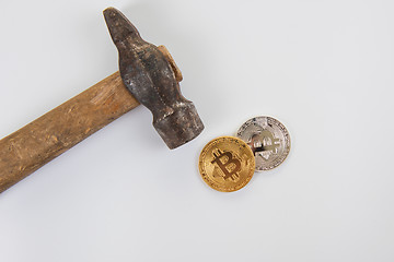 Image showing Bitcoin coins with hammer