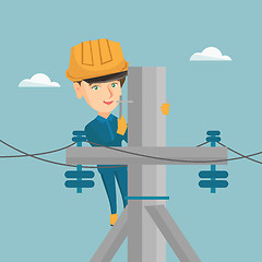 Image showing Electrician working on electric power pole.