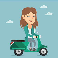 Image showing Young caucasian woman riding a scooter.