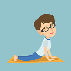 Image showing Caucasian woman practicing yoga upward dog pose.