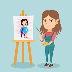 Image showing Young caucasian artist painting a portrait.