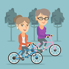 Image showing Retired caucasian women riding bicycles in park.