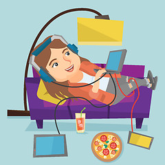 Image showing Caucasian fat woman lying on sofa with gadgets.