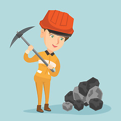 Image showing Caucasian miner in hard hat working with a pickaxe