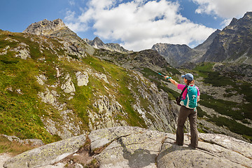 Image showing Hiking woman admiring the beauty of rocky Tatra mountains