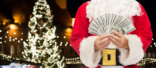 Image showing close up of santa claus with dollar money