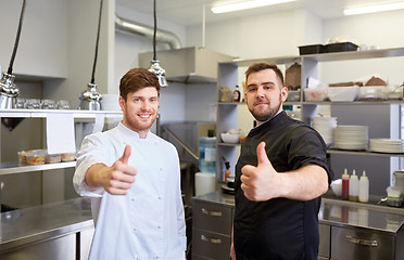 Image showing chefs at restaurant kitchen showing thumbs up