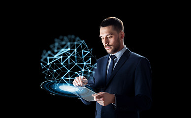 Image showing businessman with tablet pc and low poly projection