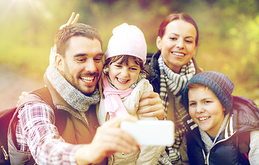 Image showing family taking selfie with smartphone in woods