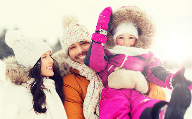 Image showing happy family with child in winter clothes outdoors