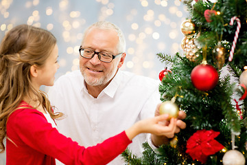 Image showing grandfather and granddaughter at christmas tree