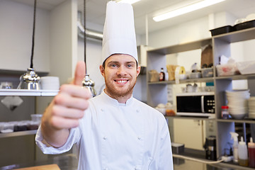 Image showing happy chef at restaurant kitchen showing thumbs up